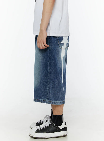 Men's Star Bolt Graphic Print Jorts (Dark Blue) IL507 side view on model highlighting white star-bolt graphic print on rear hip pocket, washed dark blue denim detail