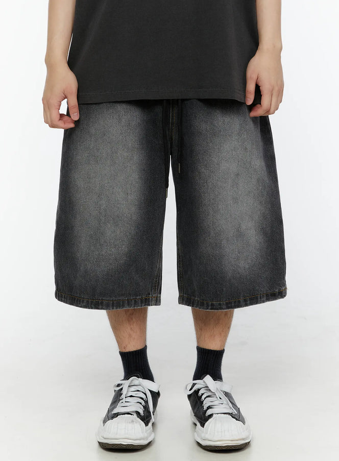 LEWKIN Men's Star Bolt Graphic Print Jorts (Dark Gray) IL507 front view on model wearing black tee and sneakers, wide-leg washed denim shorts