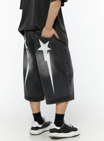 Men's Star Bolt Graphic Print Jorts (Dark Gray) IL507 angled back view on model showing white star and lightning bolt graphic print on back pocket and leg