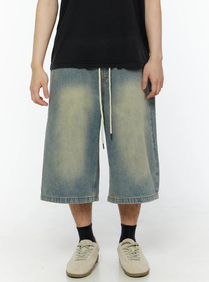 Men's Star Bolt Graphic Print Jorts (Light Blue) IL507 close-up front view on model highlighting vintage wash fading and cream drawstring detail