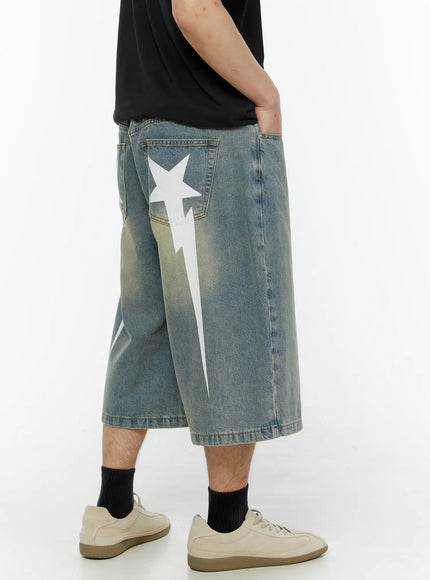 LEWKIN Men's Star Bolt Graphic Print Jorts (Light Blue) IL507 back view on model showing white star and lightning bolt graphic on washed denim