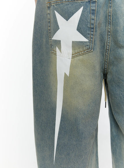 Men's Star Bolt Graphic Print Jorts (Light Blue) IL507 close-up detail on model showing white star lightning bolt graphic and faded denim texture at back