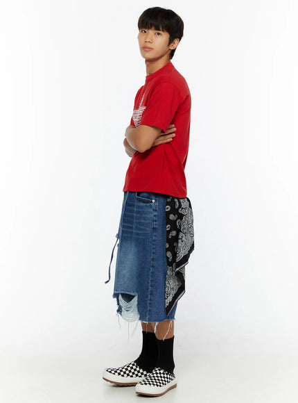 Men's Star Graphic T-Shirt IL509 Red side shot on male model arms crossed styled with distressed denim skirt and paisley bandana accessory checkered sneakers