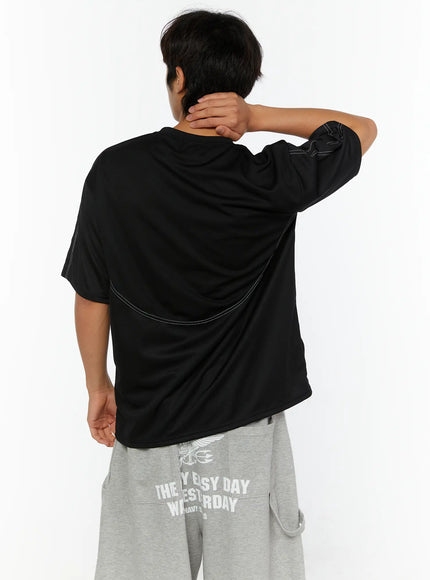 Men's Stitched T-Shirt IL513 Black back shot on male model with hand on neck showing curved contrast stitch seam across back