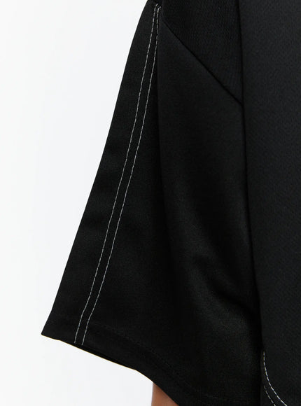 Men's Stitched T-Shirt IL513 Black close-up detail of sleeve hem showing dual white contrast topstitching lines on woven fabric texture