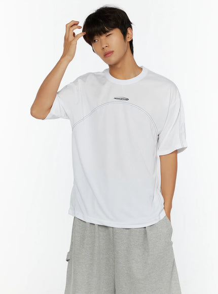 Men's Stitched T-Shirt IL513 White front shot on male model hand raised to head showing TEAM.BEGIN logo and contrast stitch detail