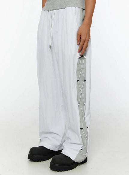 LEWKIN Men's String Detail Track Pants IL515 White size M/L side view on model showing gray lace-up cord panel detail and drawstring waist
