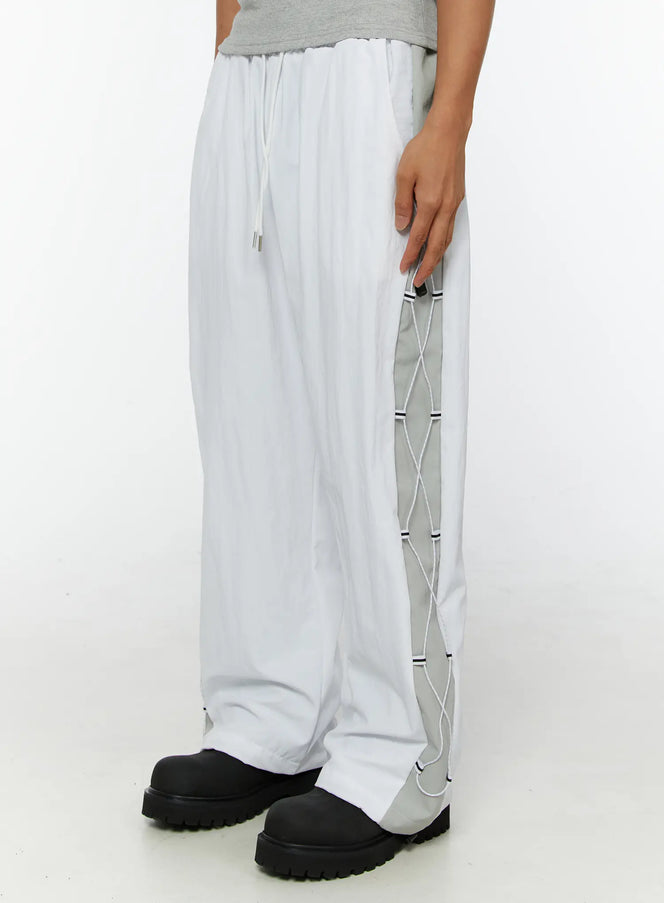 LEWKIN Men's String Detail Track Pants IL515 White size M/L side view on model showing gray lace-up cord panel detail and drawstring waist