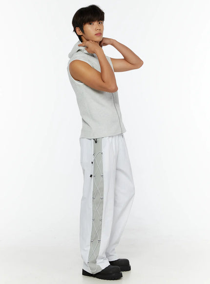 Men's String Detail Track Pants IL515 White side view on male model with arms raised styled with gray sleeveless hoodie showing full-length cord lace side panel