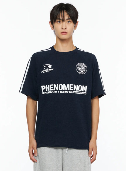 Men's Stripe Detail Tee IL528 Navy front close-up cropped view on male model showing PHENOMENON print, VANISH logo, circle badge graphic