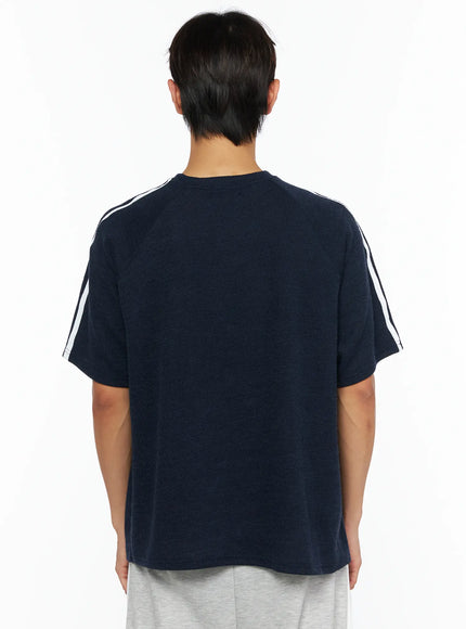 Men's Stripe Detail Tee IL528 Navy back view on male model showing clean ribbed knit back, white double shoulder stripes, crew neckline
