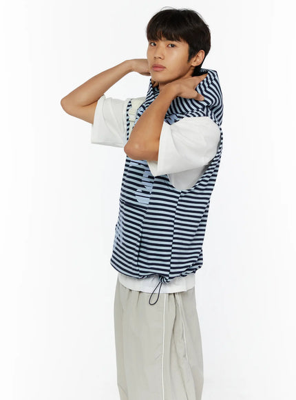 Men's Striped Graphic Hoodie IL510 Light blue dynamic side shot on male model with arms raised adjusting hood, revealing sleeveless cut and stripe texture