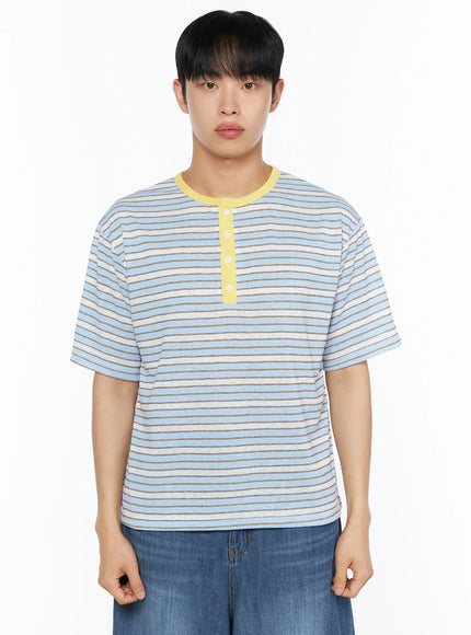 Men's Striped Henley Tee IL514 Blue cropped front shot on male model showing yellow contrast collar button placket light blue stripe oversized tee