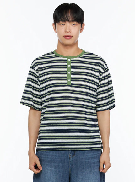 Men's Striped Henley Tee IL514 Green cropped front shot on male model highlighting green henley placket white buttons and multistripe cotton fabric