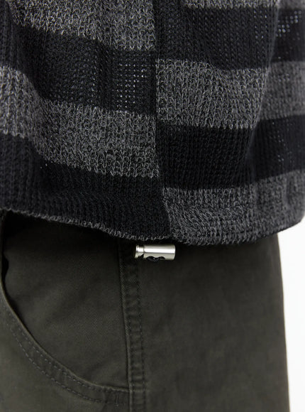 Men's Striped Knit Zip-Up Hoodie IL528 Black close-up detail shot hem and silver barrel drawcord stopper charcoal black open-knit stripe texture ribbed bottom edge