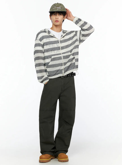 Men's Striped Knit Zip-Up Hoodie IL528 Gray White full-body model shot cap tilted hand raised casual pose zip-up hoodie open-knit stripe with cargo pants and tan boots