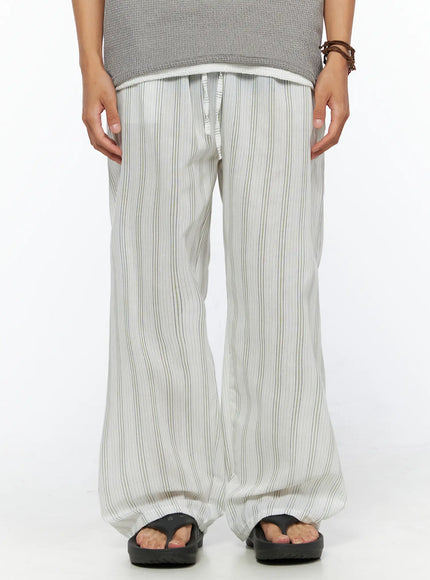 LEWKIN Men's Striped Lounge Pants IL520 Light green front close-up on model showing drawstring waistband and wide-leg striped linen fabric, size M/L