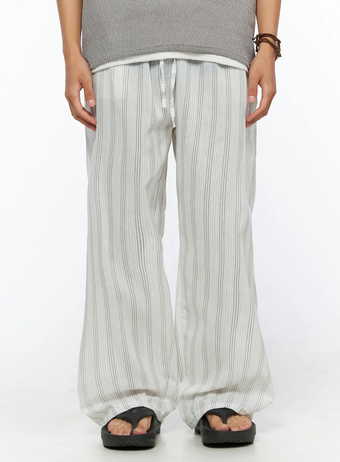 LEWKIN Men's Striped Lounge Pants IL520 Light green front close-up on model showing drawstring waistband and wide-leg striped linen fabric, size M/L