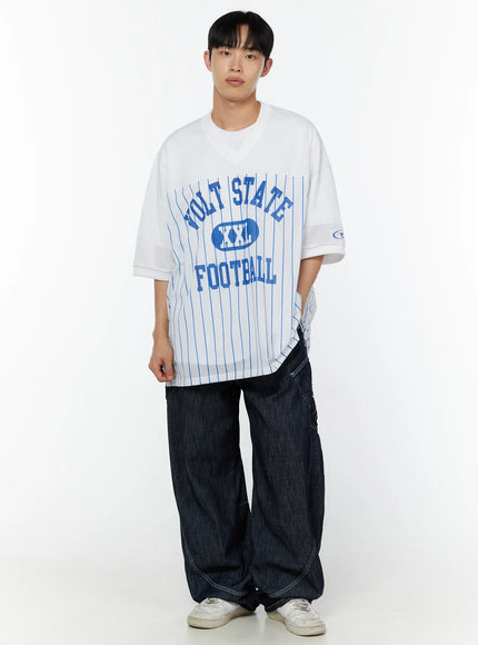 LEWKIN Men's Striped Oversized T-Shirt IU529 White front full-body model shot styled with dark wide-leg jeans and white sneakers, blue VOLT STATE FOOTBALL graphic on mesh fabric