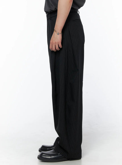 Men's Striped Pintuck Wide Pants IU523 Black side shot on model showing straight wide-leg fall and pinstripe fabric with back pocket detail and black loafers