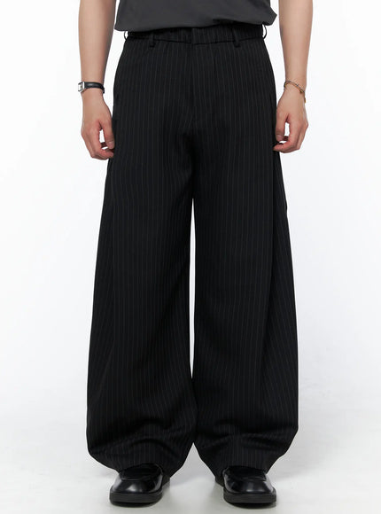 Men's Striped Pintuck Wide Pants IU523 Black front close-up on model showing ultra-wide leg opening and pinstripe pattern with waistband detail