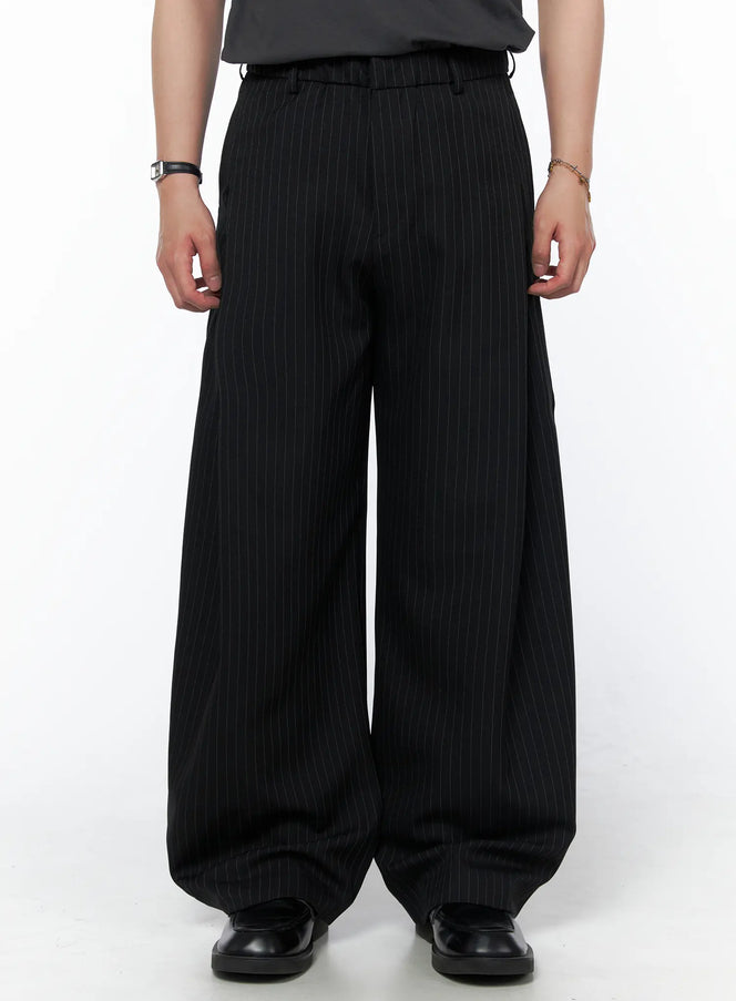 Men's Striped Pintuck Wide Pants IU523 Black front close-up on model showing ultra-wide leg opening and pinstripe pattern with waistband detail