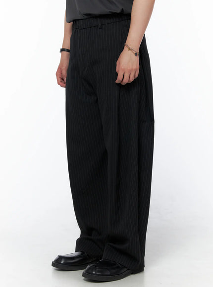 Men's Striped Pintuck Wide Pants IU523 Black side shot on model showing wide-leg silhouette and vertical pinstripe texture with black loafers