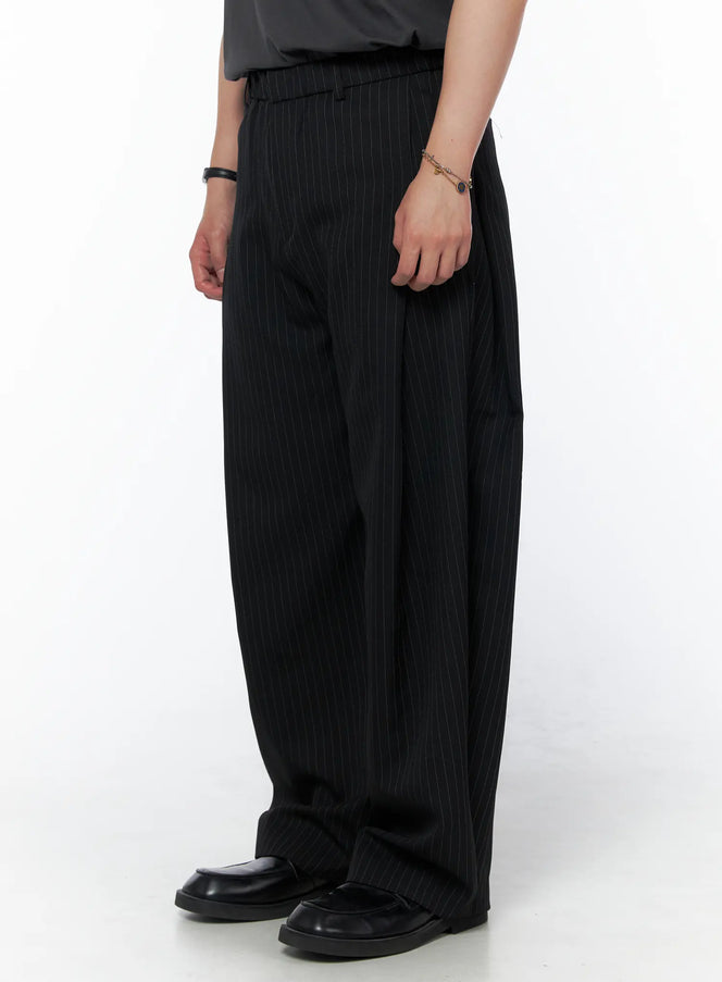 Men's Striped Pintuck Wide Pants IU523 Black side shot on model showing wide-leg silhouette and vertical pinstripe texture with black loafers