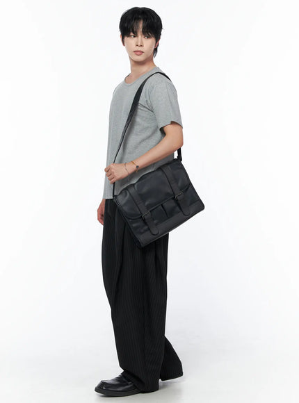 Men's Striped Pintuck Wide Pants IU523 Black side full-body shot on male model carrying black messenger bag styled with gray t-shirt