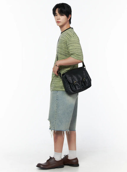 Men's Striped Short Sleeve Tee IL502 Green side profile shot on male model carrying black leather crossbody bag styled with denim shorts and white socks