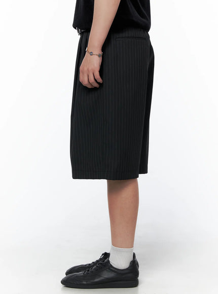 Men's Striped Shorts & Belt Set (Black) IL502 Black right side model shot showing knee-length wide silhouette pinstripe shorts with white socks and black sneakers