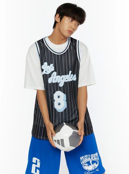 Men's Striped Sleeveless Jersey IL509 Black front shot on male model holding soccer ball at waist, looking sideways, Los Angeles script and number 8 detail visible