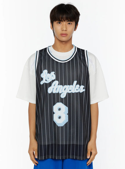 Men's Striped Sleeveless Jersey IL509 Black close-up front shot on male model from chest up, light blue Los Angeles script and number 8 on black pinstripe mesh fabric