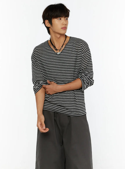 Men's Striped V-Neck Long Sleeve Tee IL515 black-gray close-up three-quarter shot on model hands crossed at waist showing stripe texture and V-neck detail