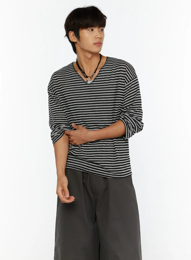 Men's Striped V-Neck Long Sleeve Tee IL515 black-gray close-up three-quarter shot on model hands crossed at waist showing stripe texture and V-neck detail