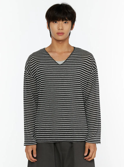 Men's Striped V-Neck Long Sleeve Tee IL515 black-gray front close-up shot on model showing wide V-neck dropped shoulder fit and bold black and gray horizontal stripes