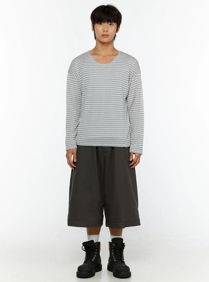 Men's Striped V-Neck Long Sleeve Tee IL515 Gray front shot on model full-body standing straight no accessories paired with wide charcoal shorts and boots