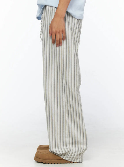 Men's Striped Wide-Leg Pants IL515 Light beige side shot on model showing full-length profile of wide-leg silhouette, crinkled seersucker texture and elasticated waist