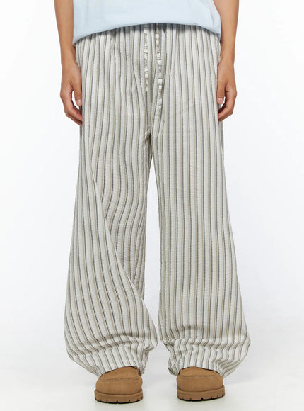LEWKIN Men's Striped Wide-Leg Pants IL515 Light beige close-up front model shot showing seersucker stripe texture and button fly waistband detail, M/L