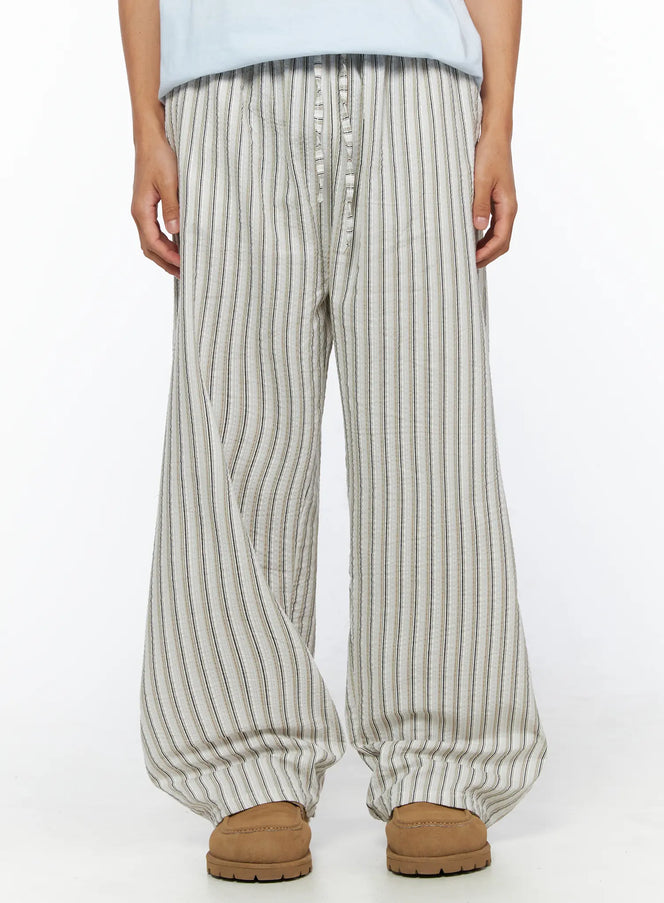 LEWKIN Men's Striped Wide-Leg Pants IL515 Light beige close-up front model shot showing seersucker stripe texture and button fly waistband detail, M/L