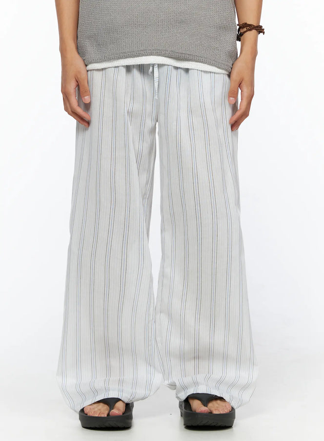 LEWKIN Men's Striped Wide-Leg Pants IL520 Light blue front view on model wearing gray knit top and sandals, wide-leg silhouette with drawstring elastic waist