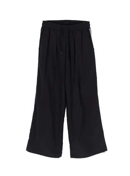 Men's Striped Wide Leg Track Pants IL502 Black flat-lay front view showing elastic drawstring waist wide leg cut white side stripe and hem cinch detail