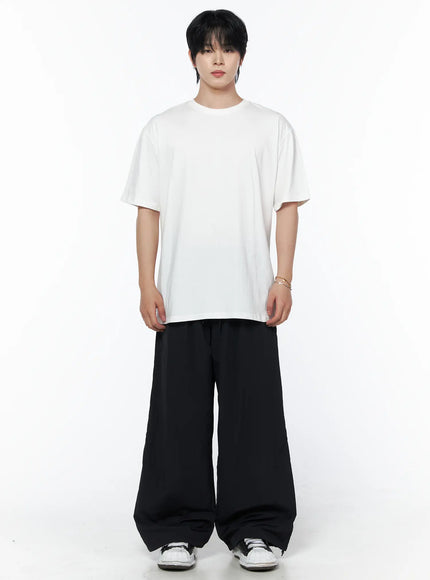 Men's Striped Wide Leg Track Pants IL502 Black full front shot on male model wearing white oversized tee standing straight showing wide leg silhouette