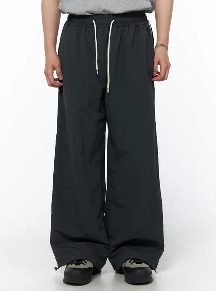 Men's Striped Wide Track Pants IU523 dark gray front view on model showing cream drawstring waist and ankle drawcord hem with wide leg silhouette