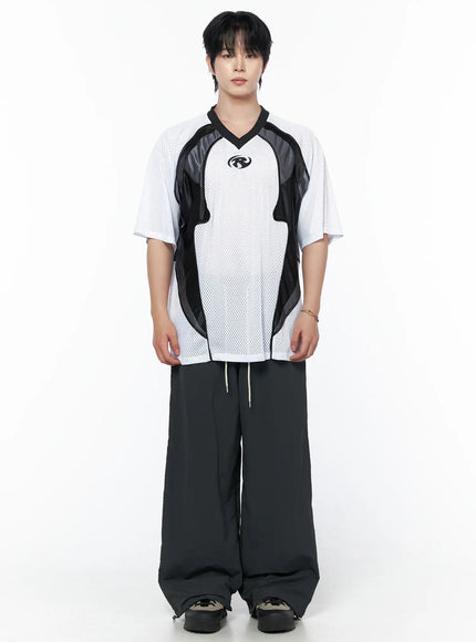 Men's Striped Wide Track Pants IU523 dark gray full-body front view on male model standing straight styled with white mesh V-neck sports tee