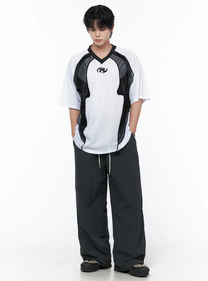Men's Striped Wide Track Pants IU523 dark gray full-body front view on male model looking down styled with white mesh sports top