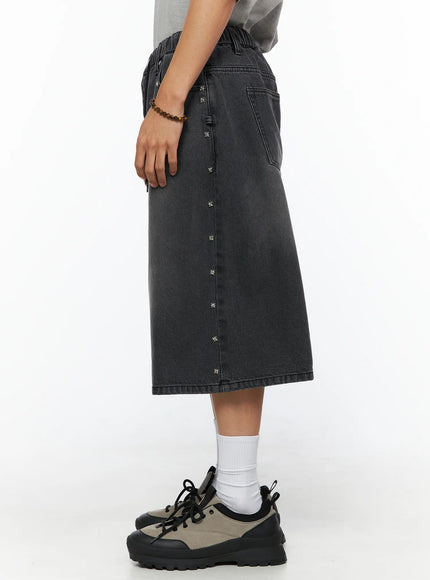 Men's Studded Jorts IL520 Black side view on model showing silver star stud trim along outer seam, elastic waistband and back pocket