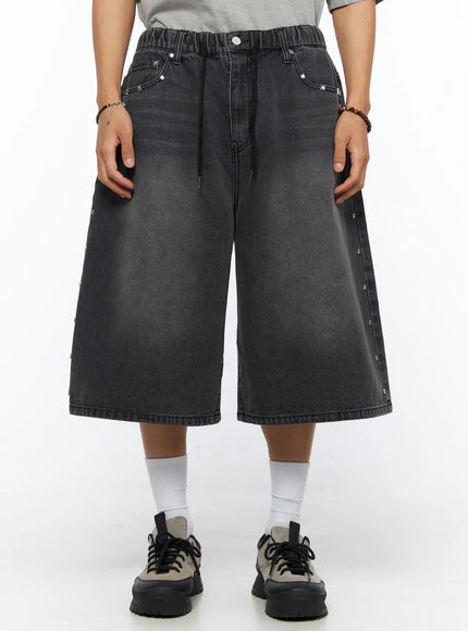 LEWKIN Men's Studded Jorts IL520 Black front view on model wearing gray tee, wide-leg washed denim shorts with silver star studs