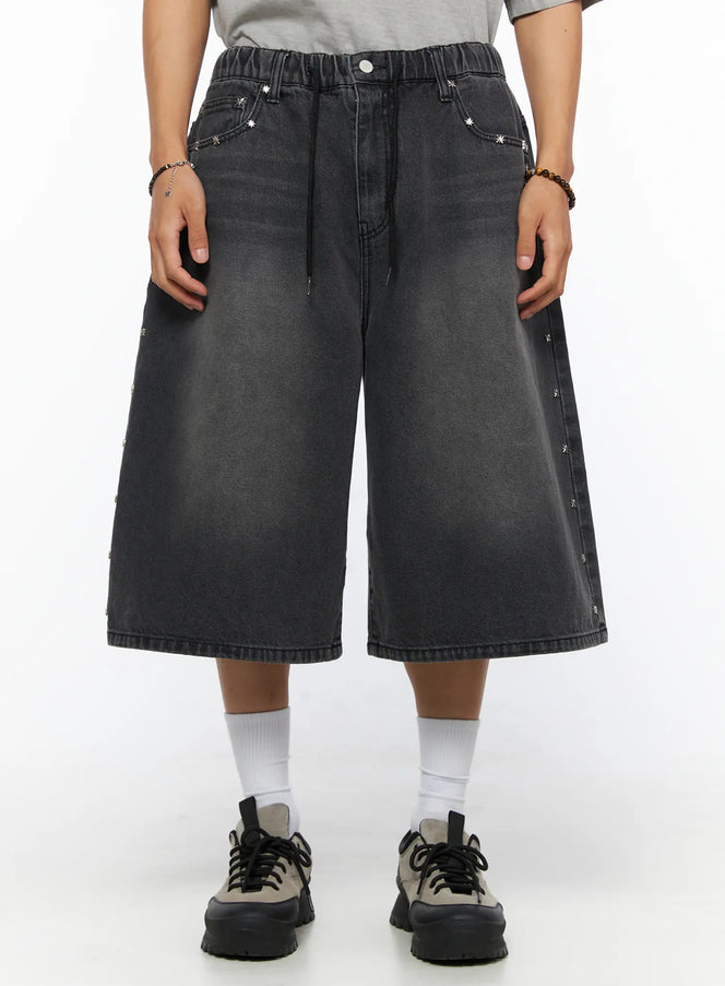 LEWKIN Men's Studded Jorts IL520 Black front view on model wearing gray tee, wide-leg washed denim shorts with silver star studs