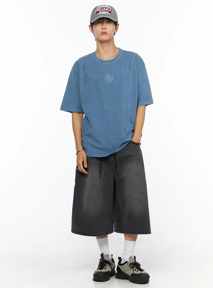 Men's Sun Embroidery T-Shirt IL520 Light blue full-body front shot on male model wearing cap with one hand in pocket relaxed street pose